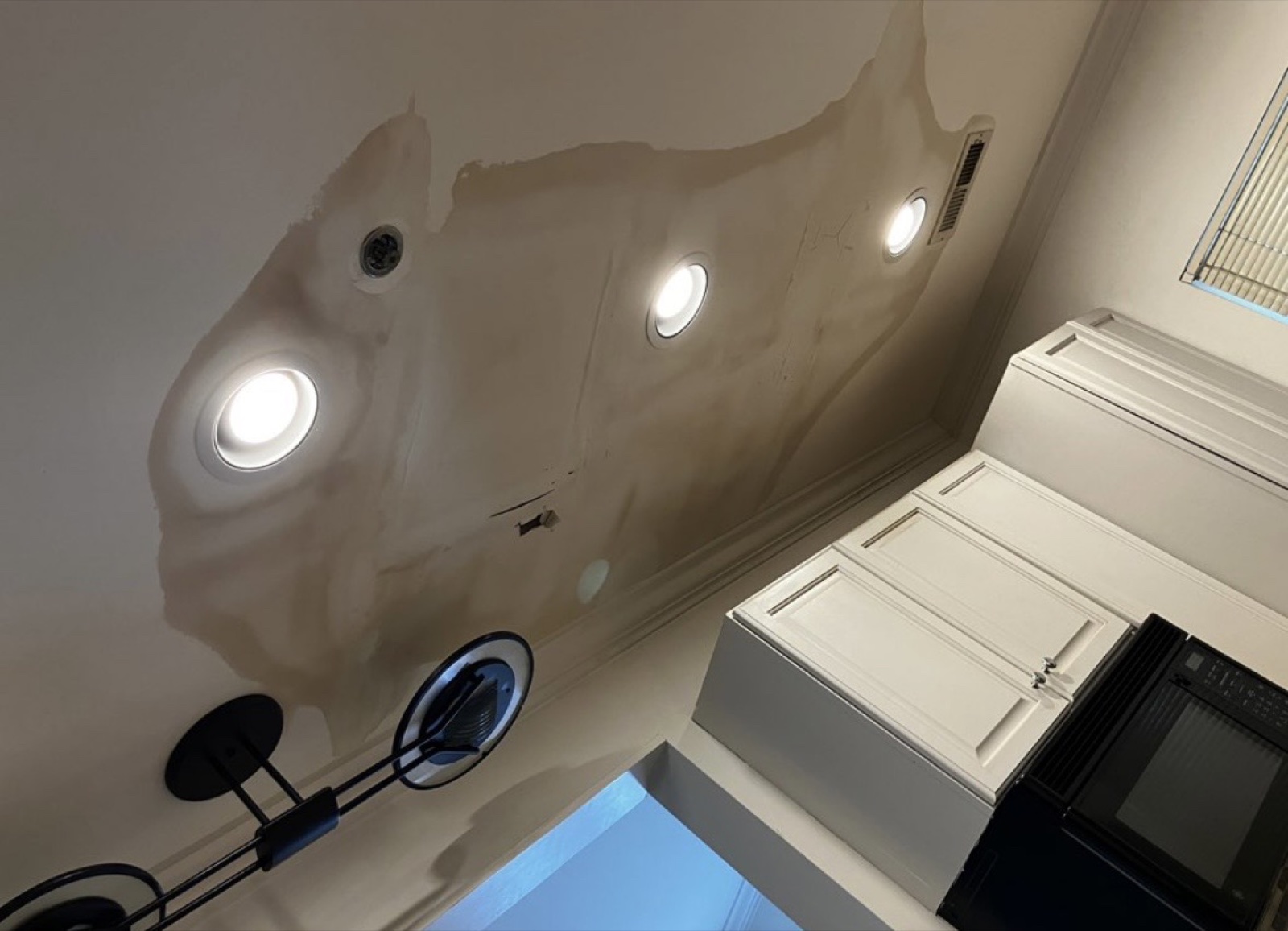 Water-damaged kitchen ceiling before repair