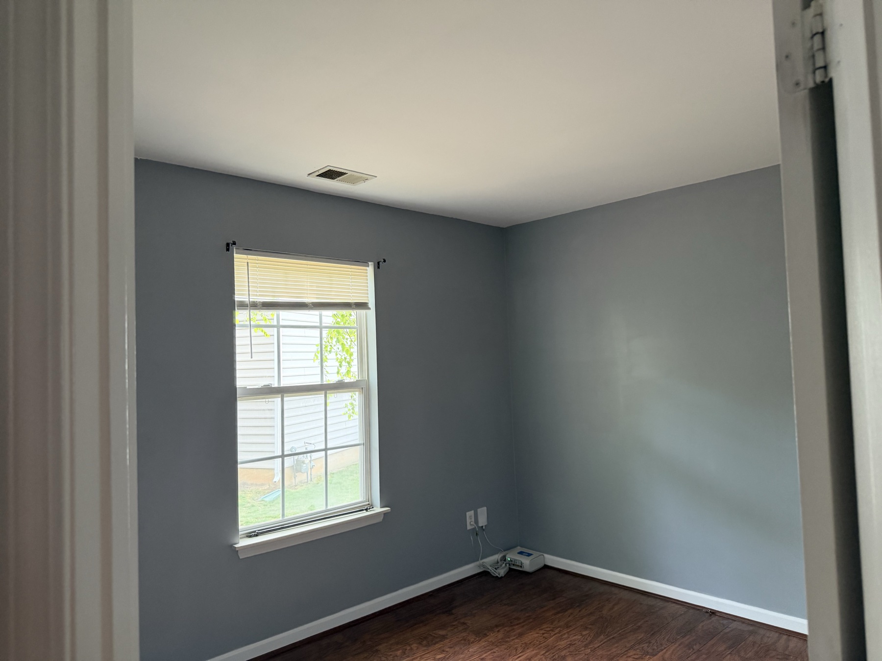 Bedroom after gray interior wall painting